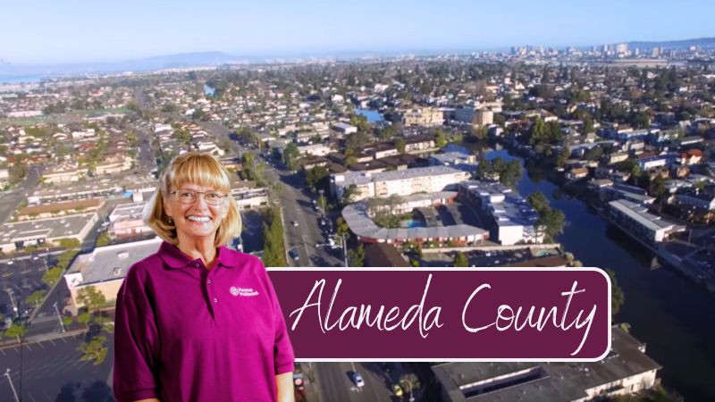 Home Instead caregiver with Alameda County, CA in the background