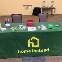 Home Instead booth at fall job fair