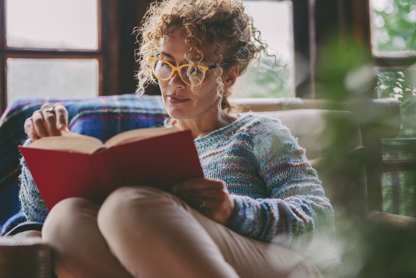 bigstock Woman At Home Sitting And Read 467714967