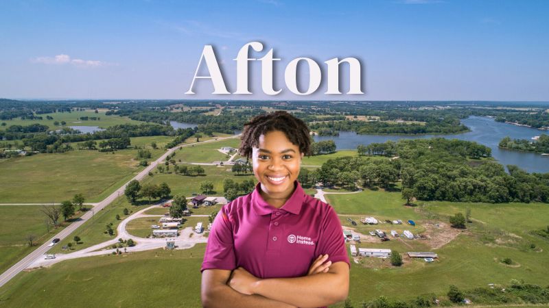 Home Instead caregiver with Afton Oklahoma in the background