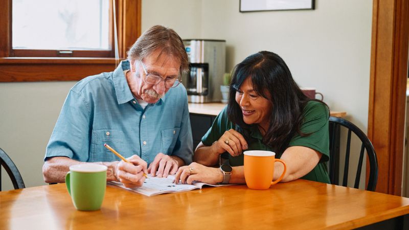 Home Instead caregiver with senior client