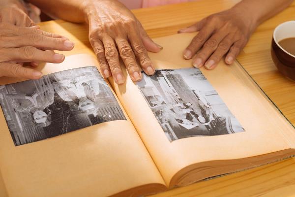 bigstock Watching Old Photos 96033575