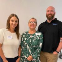 home instead team members at coffee event