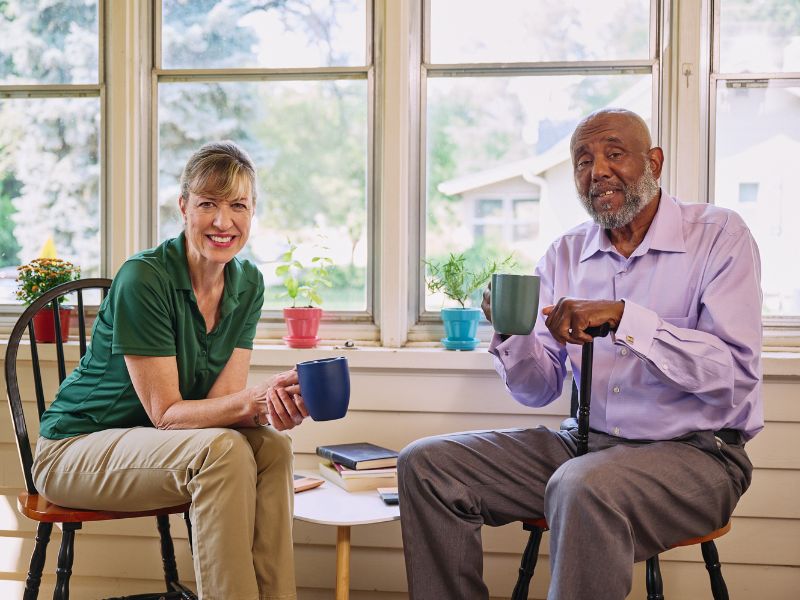 Home Instead caregiver assisting a senior client