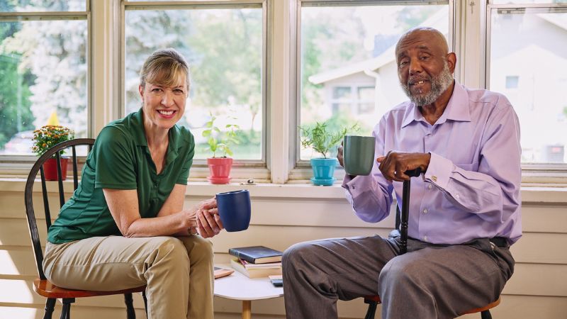 Home Instead caregiver with senior client in Holmes Beach, FL