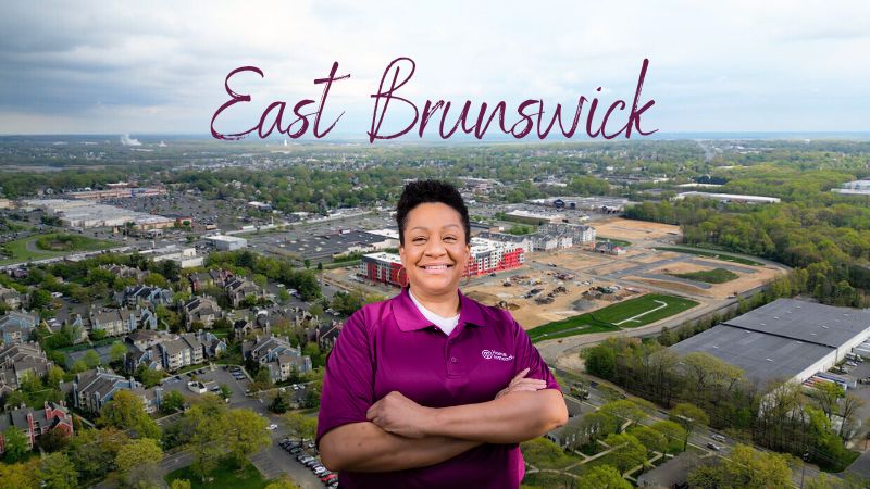 Home Instead caregiver with East Brunswick, New Jersey in the background