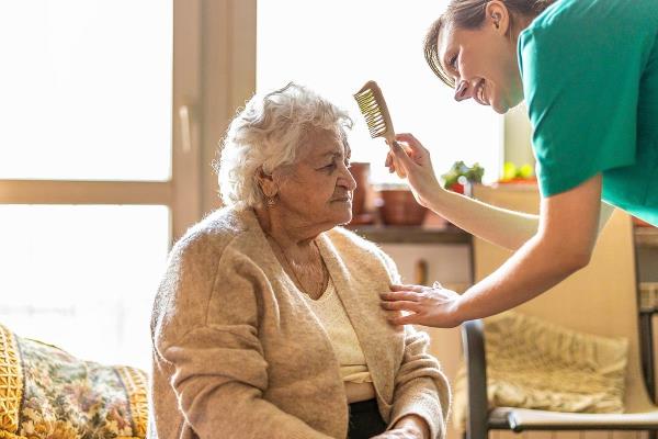 bigstock Female nurse taking care of a 412940275