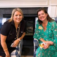 two woman stop for a photo at the Meet and Greet