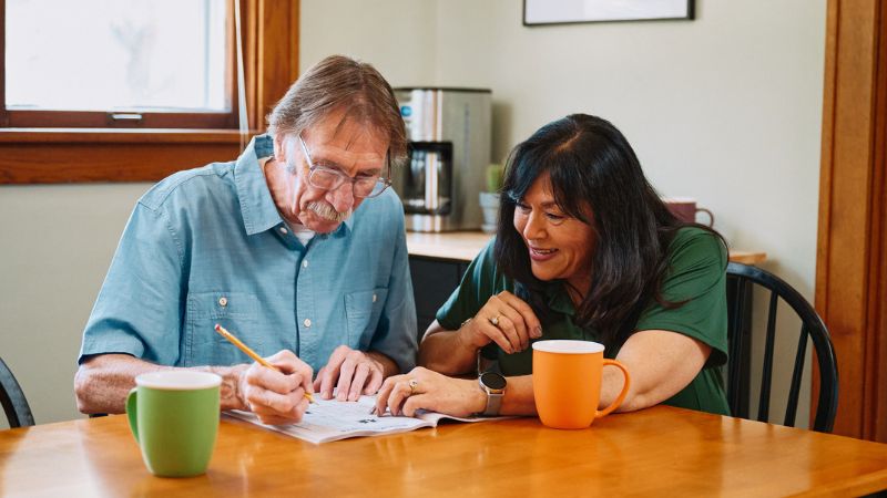 Home Instead caregiver with senior client