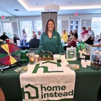 home instead booth at wellness event in scituate