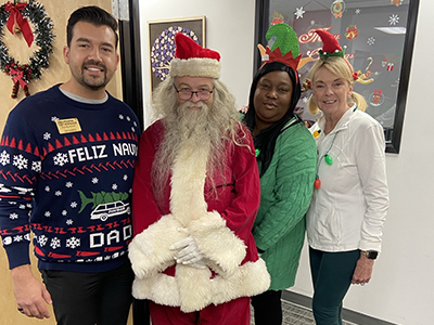 Home Instead Team with Santa at the BASTAS Wrapping Party